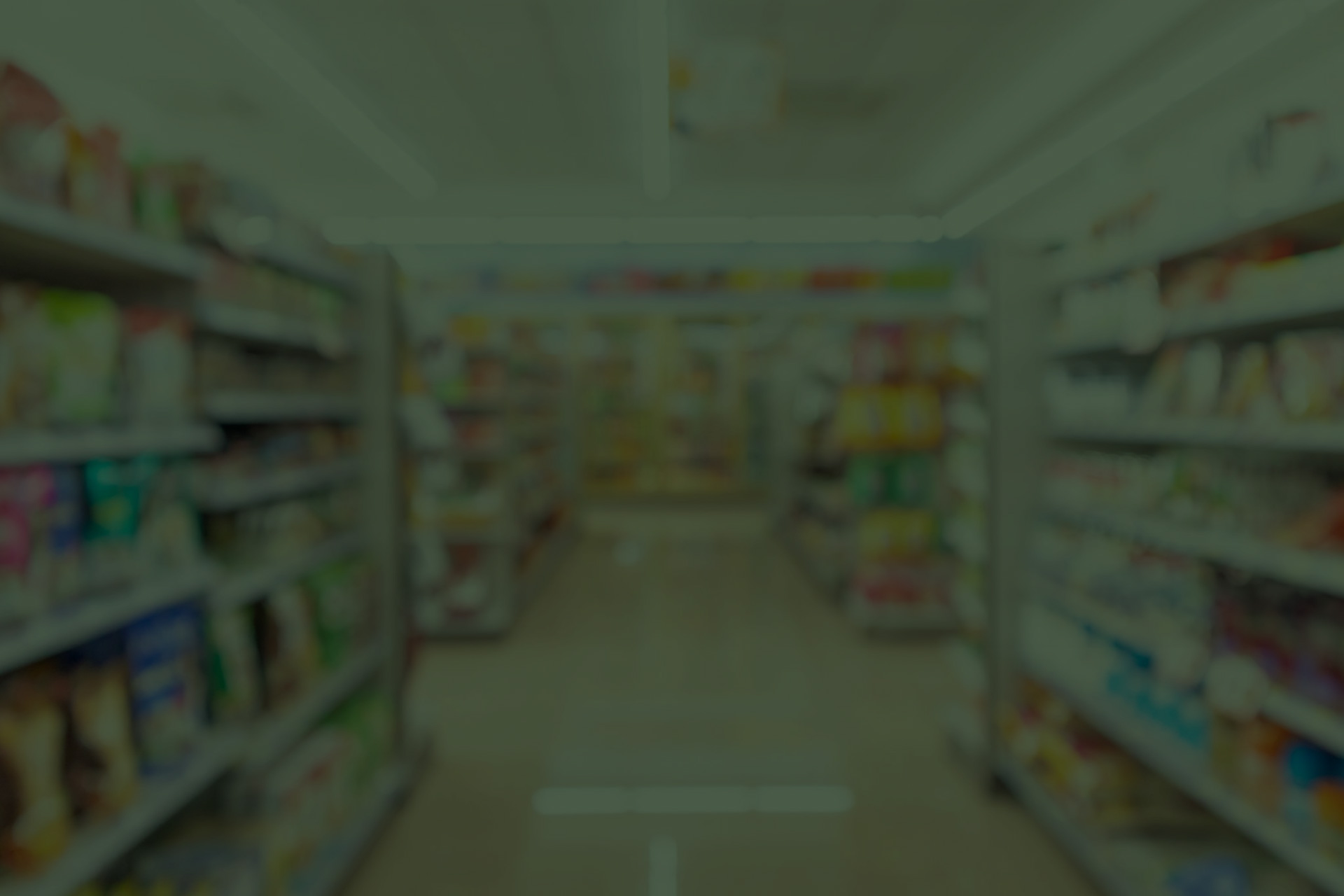 The aisle of a supermarket filled with food.