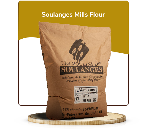 A bag of soulanges artisan winter wheat flour, sitting on a wooden pedestal.